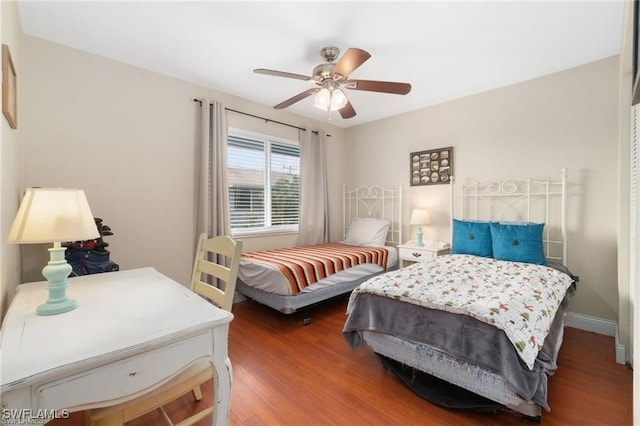 bedroom featuring ceiling fan and hardwood / wood-style floors