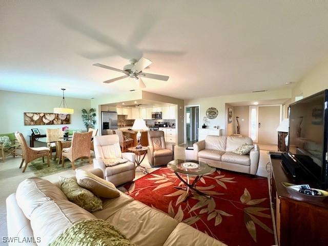 living room with ceiling fan