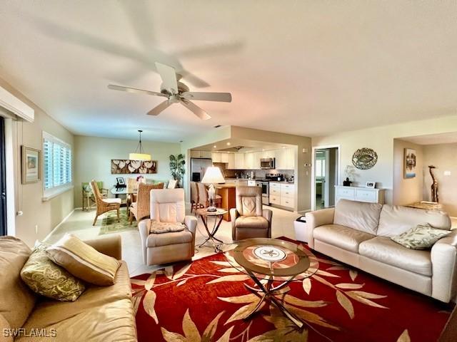 living room with ceiling fan