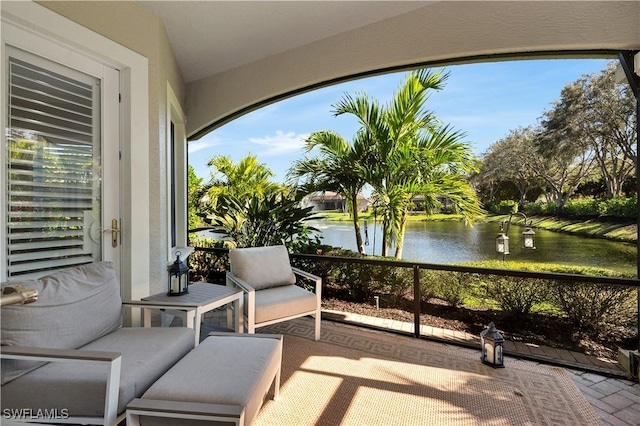 view of patio with a water view