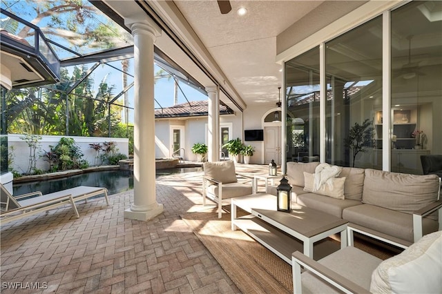 exterior space with ornate columns and ceiling fan