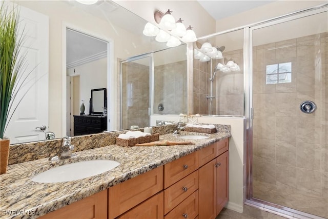 bathroom with vanity, ornamental molding, and walk in shower