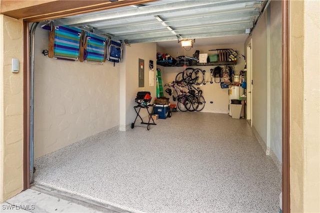 garage featuring a garage door opener and electric panel