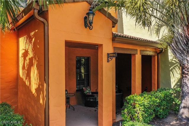 entrance to property with a patio area