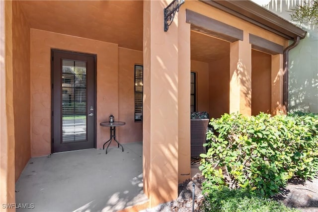 entrance to property with a patio area