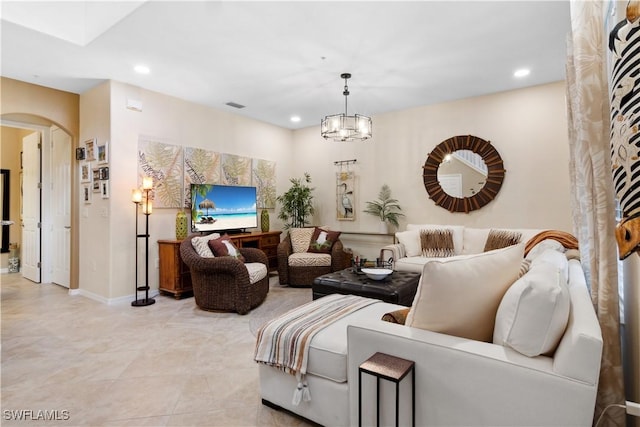 living room with a notable chandelier