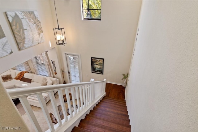 stairs featuring wood-type flooring