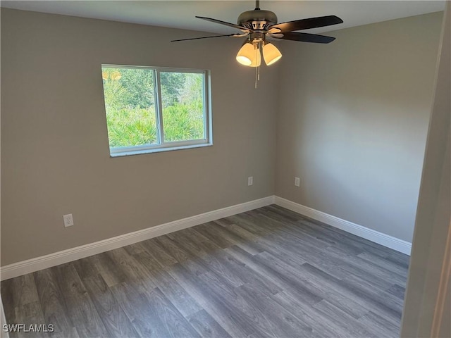 spare room with hardwood / wood-style flooring and ceiling fan