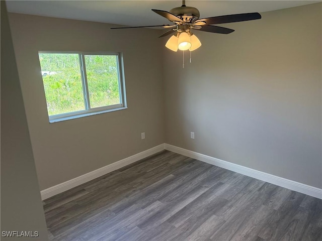 spare room with hardwood / wood-style flooring and ceiling fan