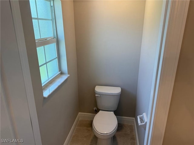 bathroom featuring tile patterned floors and toilet