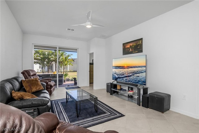 living room featuring light tile patterned floors and ceiling fan