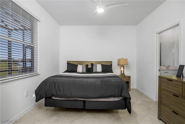 tiled bedroom featuring ceiling fan