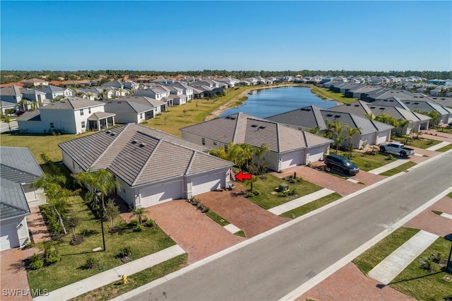 aerial view featuring a water view and a residential view