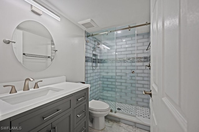 bathroom with vanity, toilet, and walk in shower