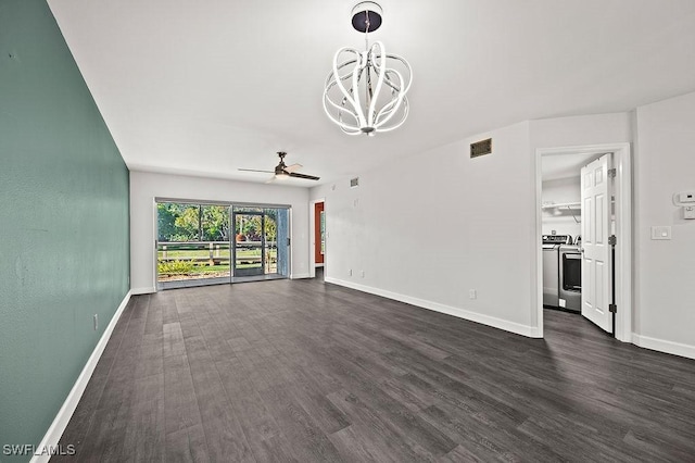 unfurnished living room with dark wood-type flooring, ceiling fan with notable chandelier, and washer / clothes dryer