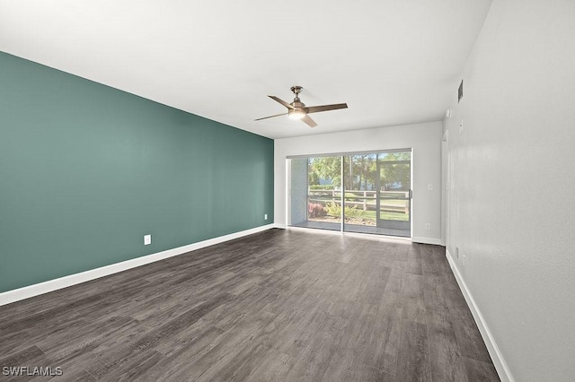 unfurnished room with ceiling fan and dark hardwood / wood-style floors