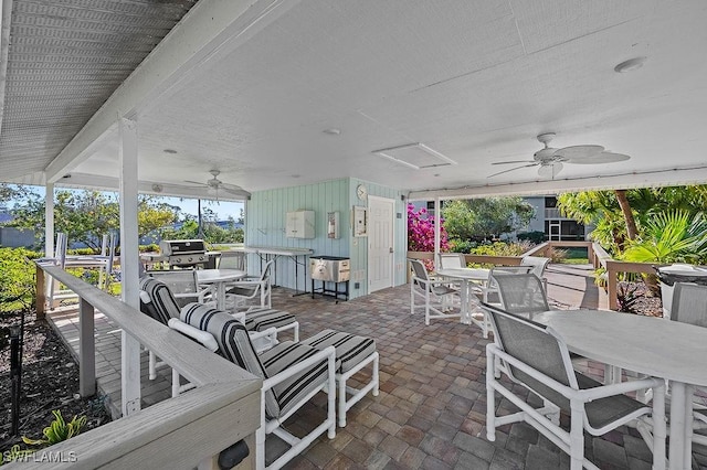 view of patio / terrace with ceiling fan and a grill