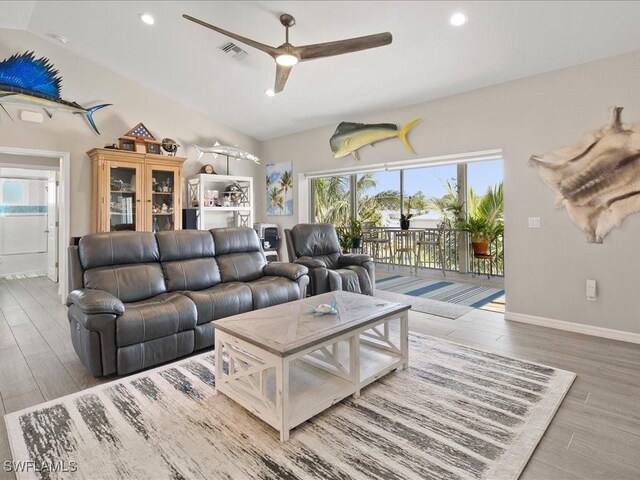 24536 Dolphin St, Bonita Springs, FL 34134 - living area with ceiling fan, wood finished floors, recessed lighting, and baseboards