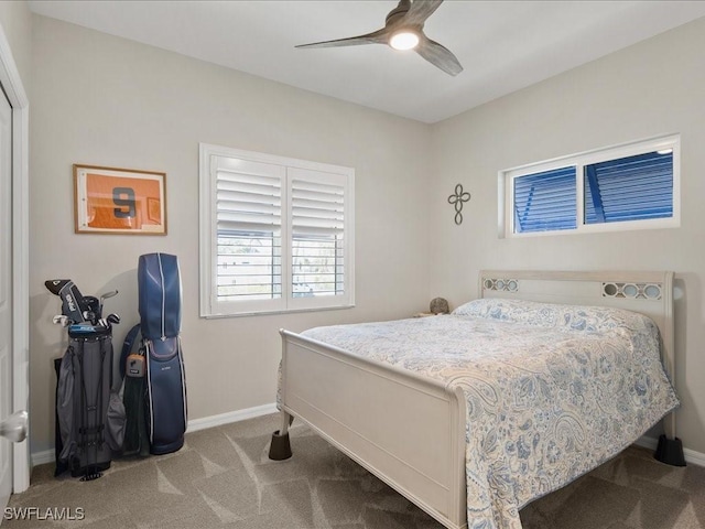 carpeted bedroom with a ceiling fan and baseboards