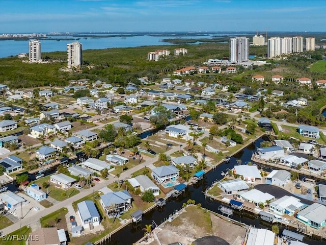 birds eye view of property with a residential view and a water view