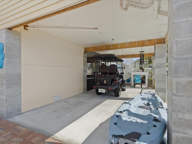 garage with an attached carport