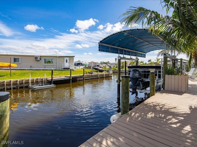 24536 Dolphin St, Bonita Springs, FL 34134 - dock featuring boat lift and a water view