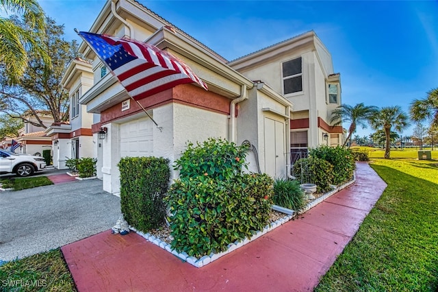 view of side of home with a garage