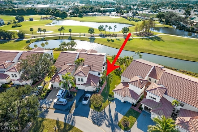 birds eye view of property featuring a water view