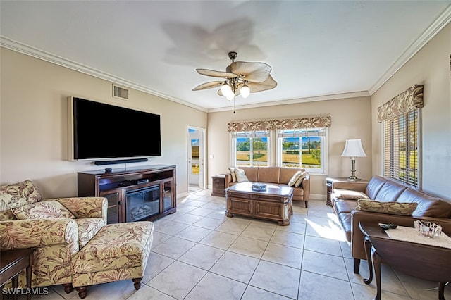 tiled living room with ornamental molding and ceiling fan