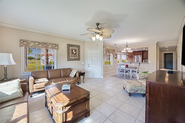 living room with crown molding, ceiling fan with notable chandelier, a wealth of natural light, and light tile patterned floors