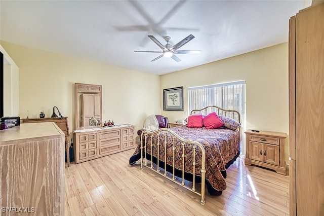 bedroom with ceiling fan and light hardwood / wood-style floors