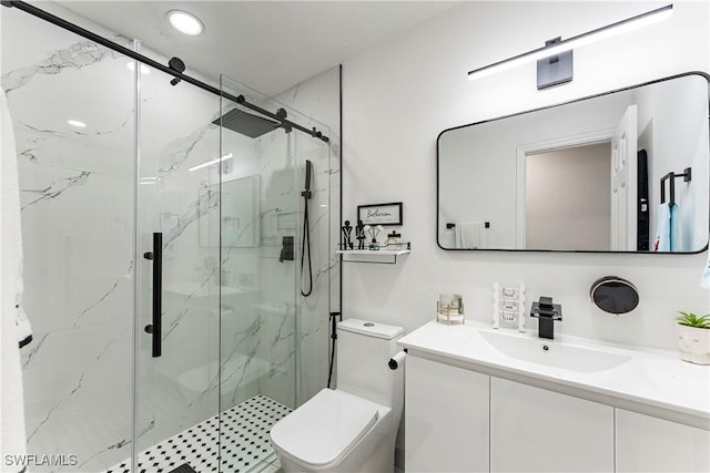 bathroom featuring vanity, toilet, and a shower with shower door