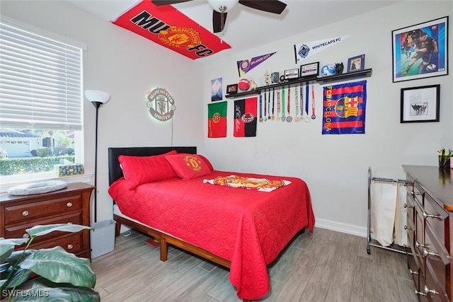 bedroom featuring ceiling fan and light hardwood / wood-style flooring