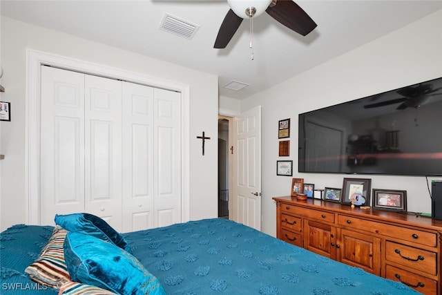 bedroom featuring ceiling fan and a closet