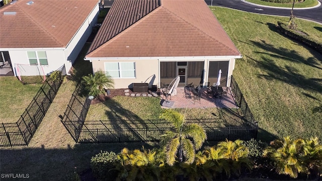 back of house with a patio area and a sunroom