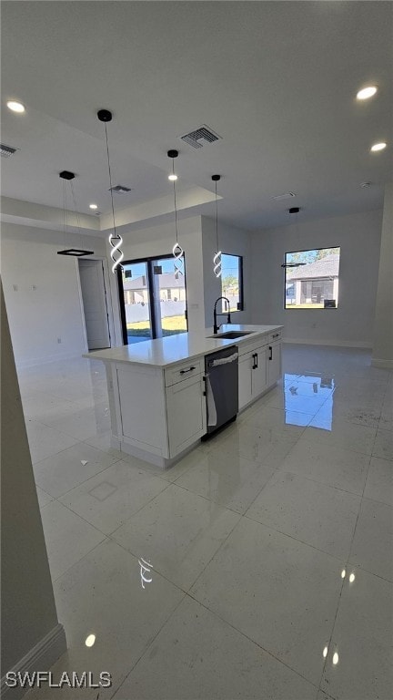 kitchen featuring sink, hanging light fixtures, a center island, white cabinets, and stainless steel dishwasher