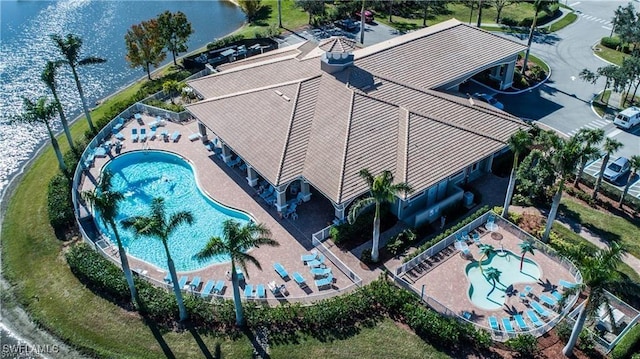 birds eye view of property with a water view