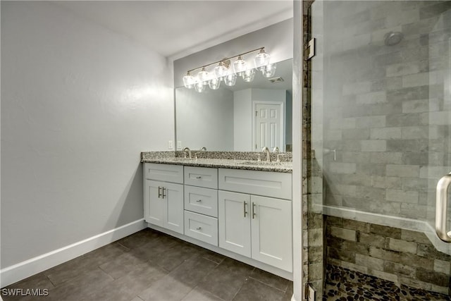 bathroom with vanity and an enclosed shower