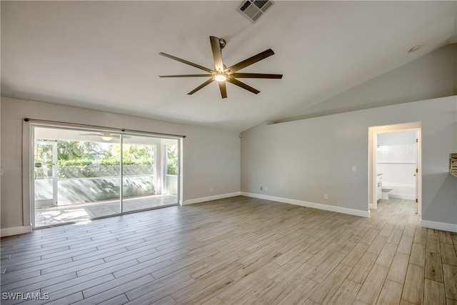 spare room with vaulted ceiling, light hardwood / wood-style floors, and ceiling fan