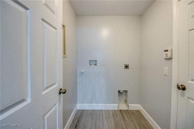 clothes washing area with hookup for an electric dryer and hookup for a washing machine