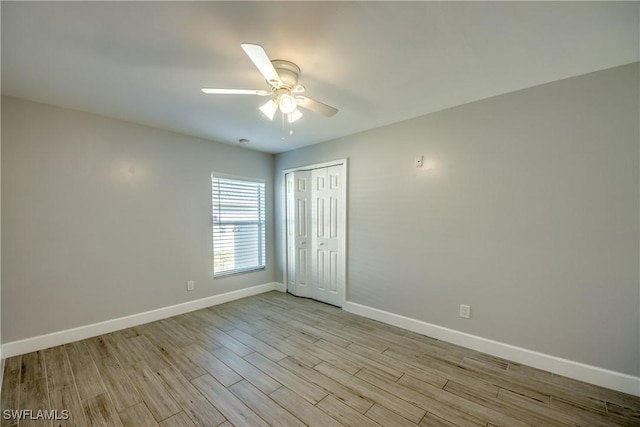 spare room with ceiling fan and light hardwood / wood-style flooring