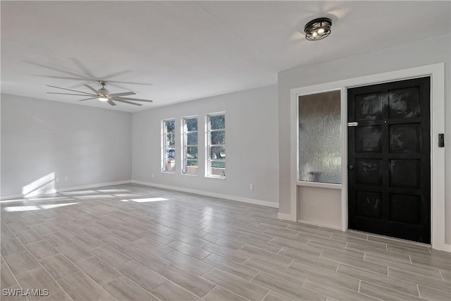 interior space with ceiling fan