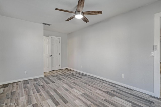 spare room with ceiling fan and light hardwood / wood-style floors