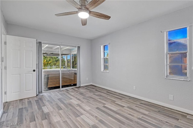 unfurnished room featuring ceiling fan and light hardwood / wood-style floors