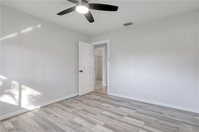 unfurnished room featuring light hardwood / wood-style floors and ceiling fan