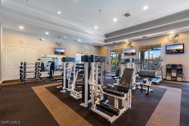 gym with a tray ceiling, visible vents, crown molding, and recessed lighting