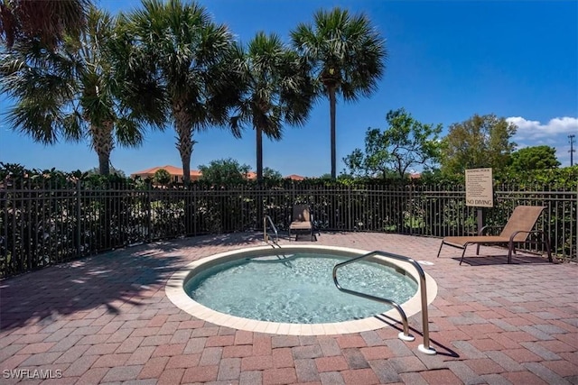 view of pool with a pool, a patio, and fence