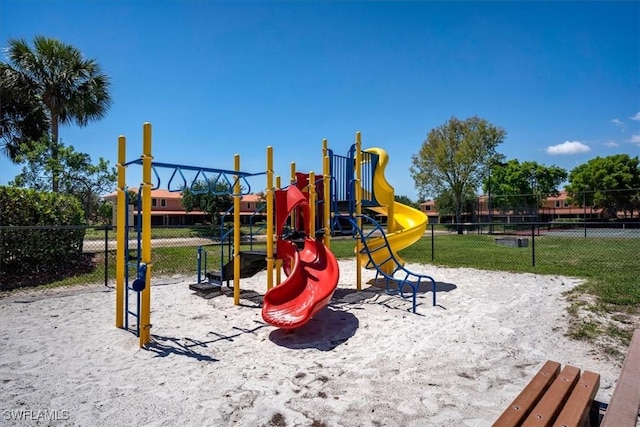 community jungle gym featuring fence