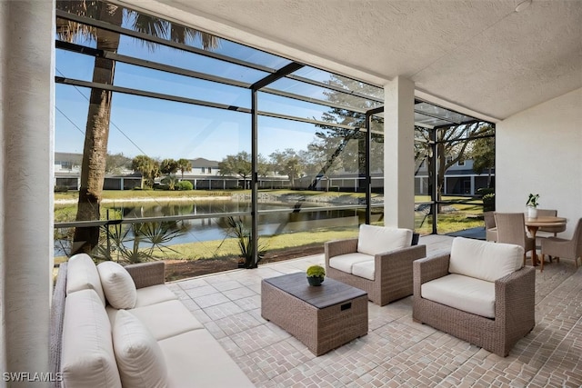 sunroom / solarium with a water view