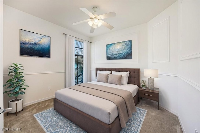 bedroom with carpet flooring, a ceiling fan, and baseboards